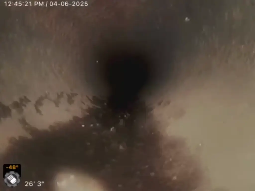 Sewer camera view of a properly functioning main line with normal pipe width.