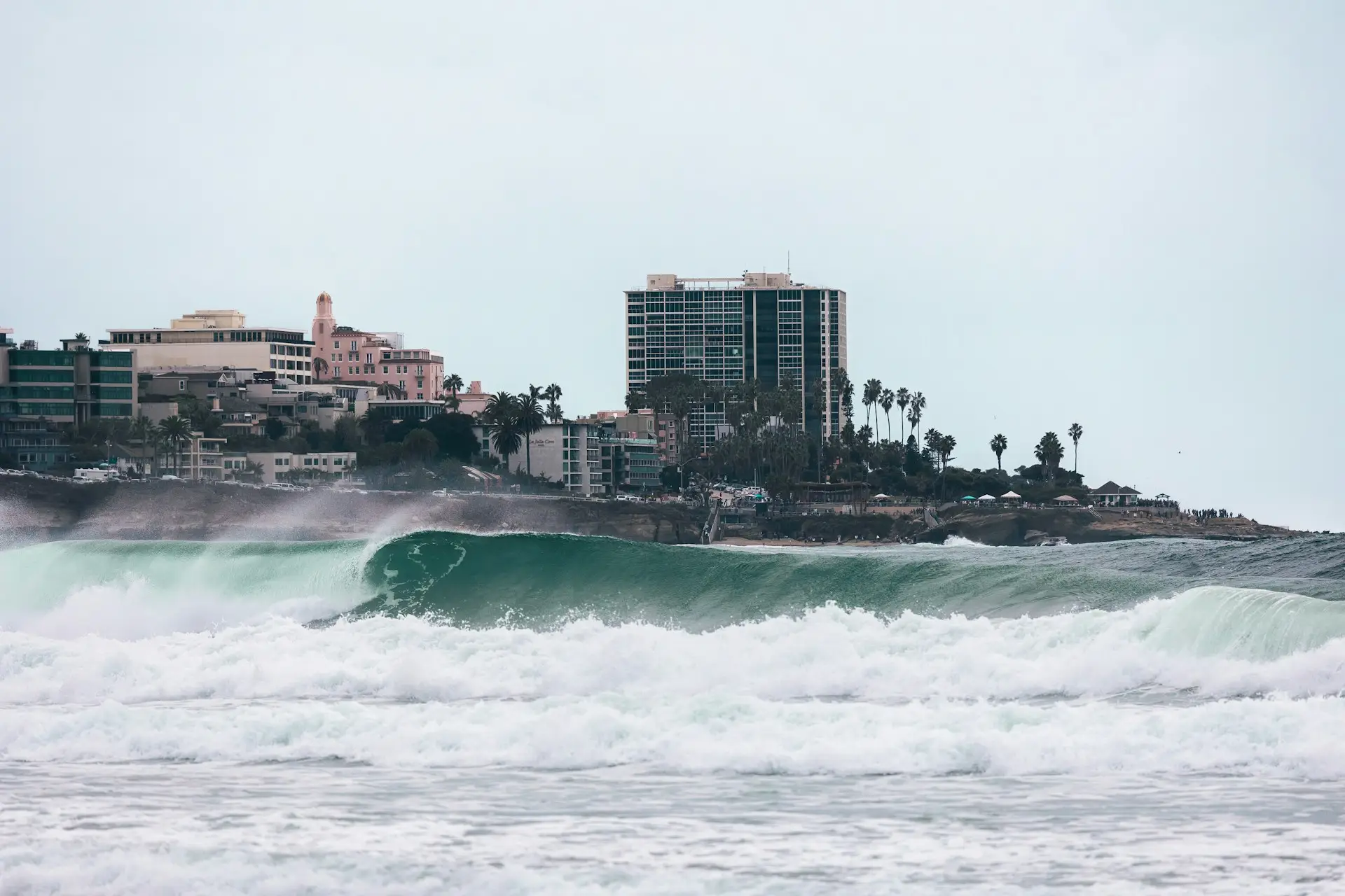 Large winter surf breaking below the bluffs at La Jolla in San Diego